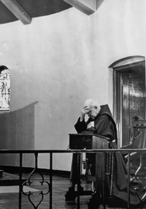 Fr. Paul praying